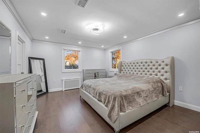 bedroom with radiator, crown molding, and dark hardwood / wood-style floors