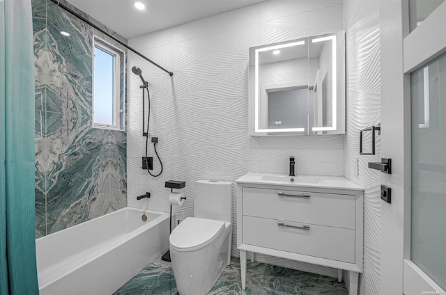 full bathroom with vanity, toilet, shower / bath combo with shower curtain, and tile walls