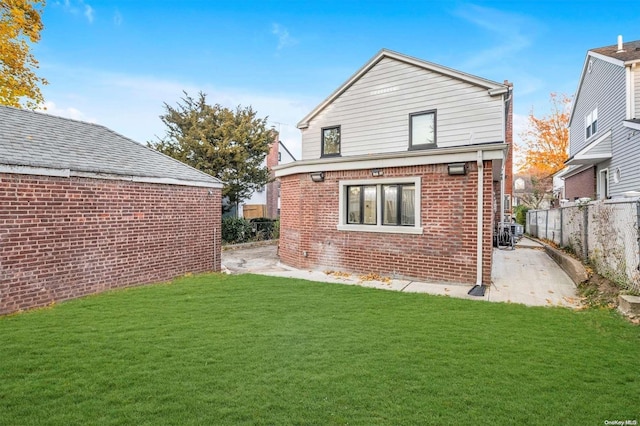 rear view of property featuring a yard and cooling unit