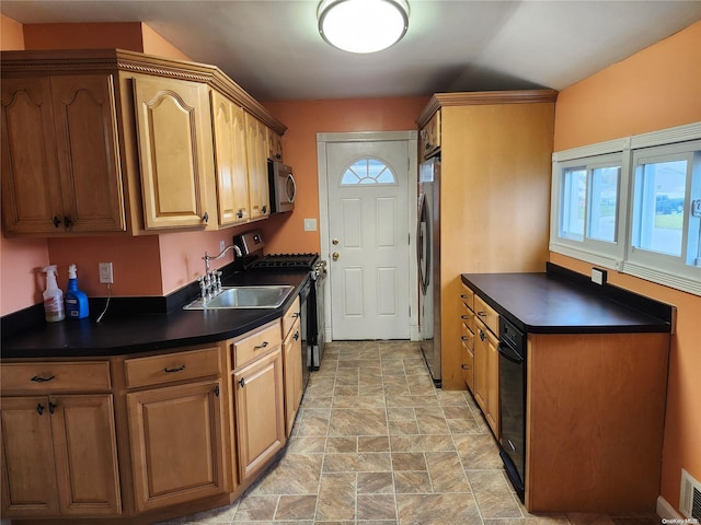 kitchen with appliances with stainless steel finishes and sink