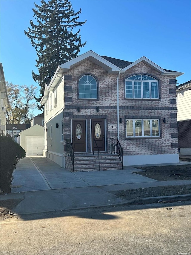 view of front of home with an outbuilding and a garage