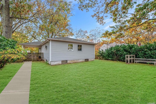 view of home's exterior with a lawn