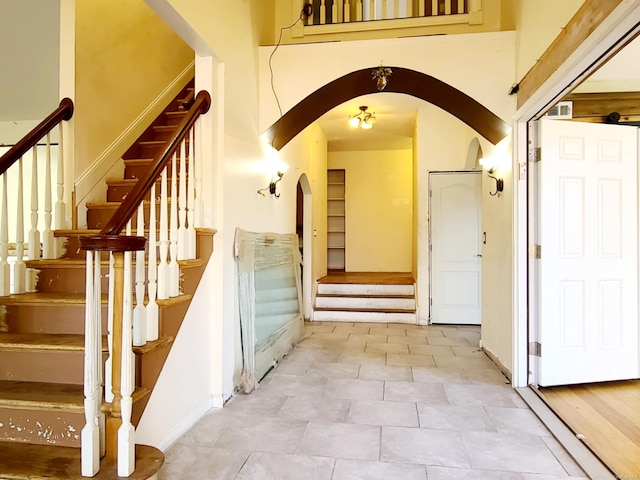 stairway with tile patterned flooring