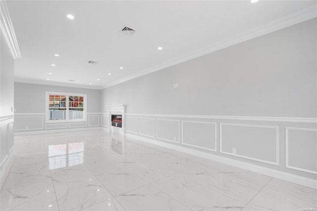 empty room featuring crown molding