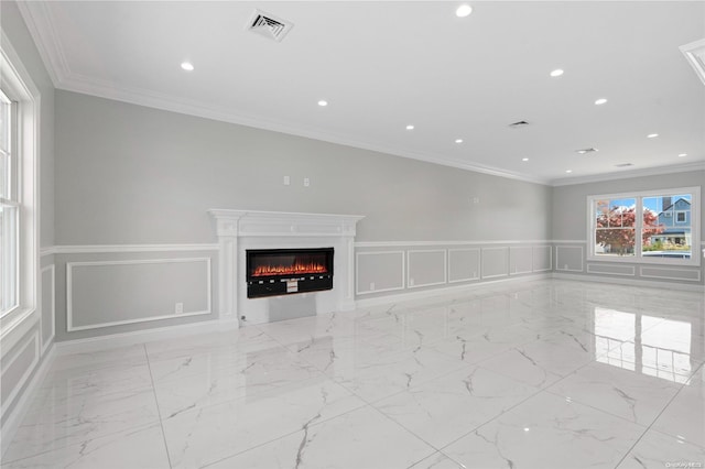 unfurnished living room featuring crown molding