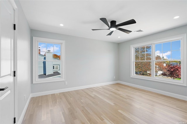 spare room with ceiling fan and light hardwood / wood-style floors