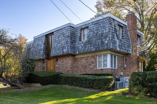 view of home's exterior with a yard