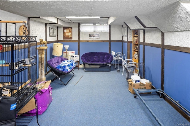 interior space with carpet floors and a textured ceiling