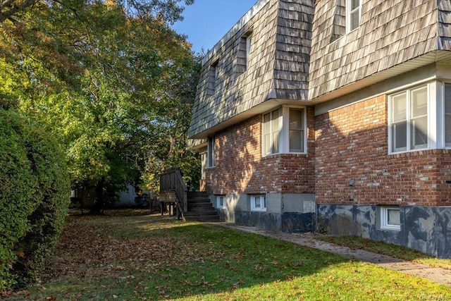 view of side of property with a yard