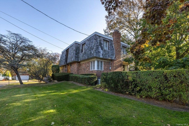 view of home's exterior featuring a yard