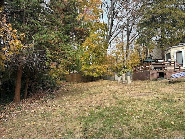 view of yard featuring a wooden deck