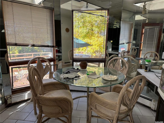 tiled dining area with a wealth of natural light