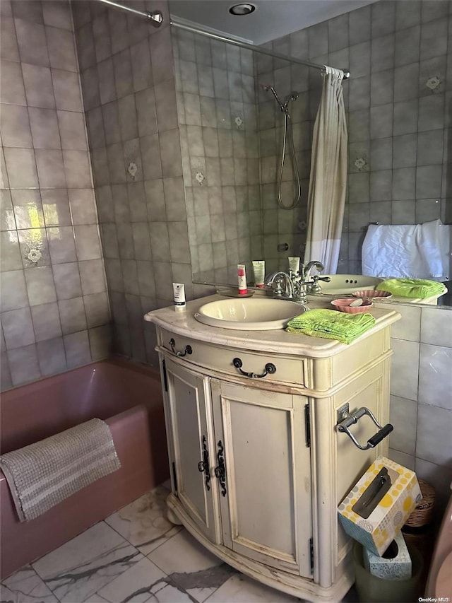 bathroom featuring tile walls, shower / tub combo, and vanity