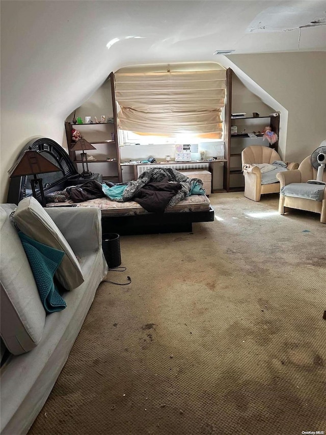 interior space with lofted ceiling and light colored carpet