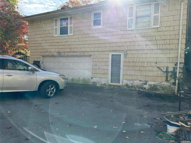 view of side of home with a garage