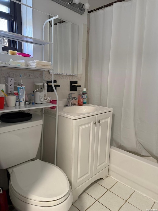 full bathroom featuring toilet, shower / bath combo, backsplash, and tile patterned floors