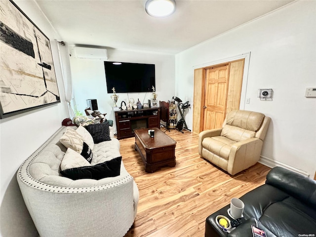 living room with wood-type flooring and a wall mounted air conditioner