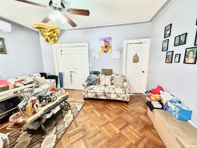 living room featuring a wall mounted air conditioner, ceiling fan, and parquet flooring