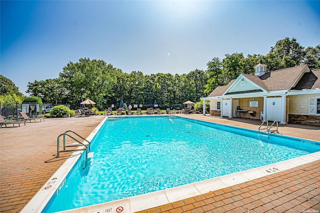 view of pool featuring a patio area