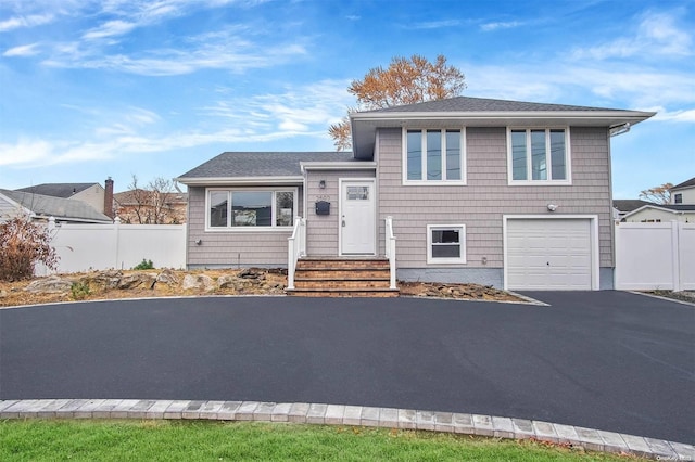 split level home with a garage