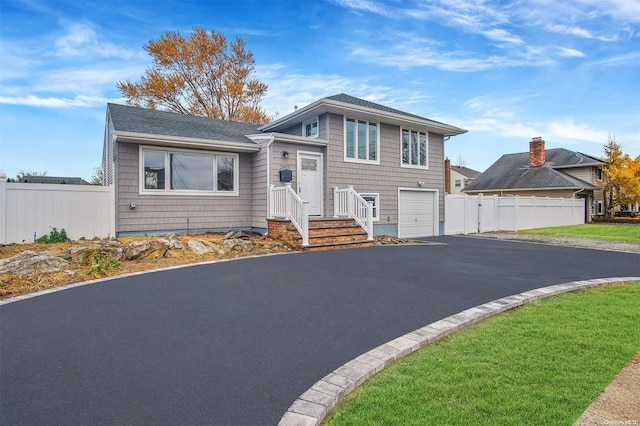 split level home featuring a garage