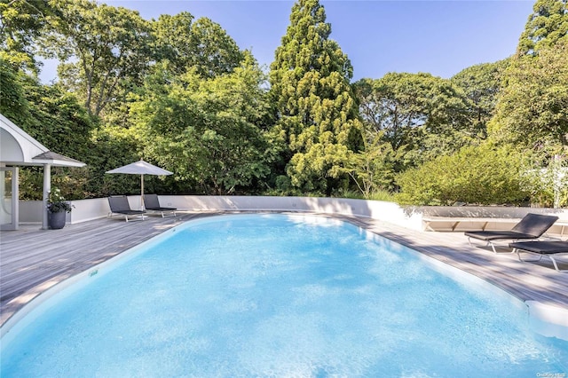 view of pool with a deck