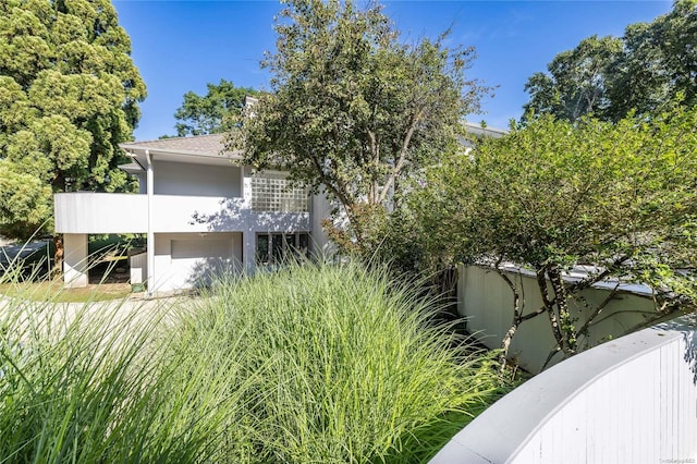 view of side of property with a garage