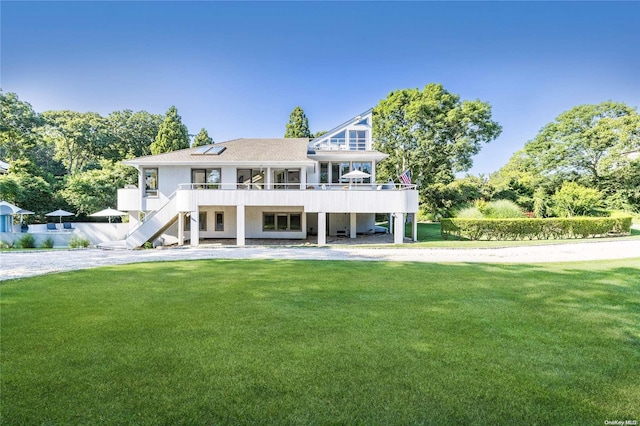 view of front of home featuring a front yard and a patio area