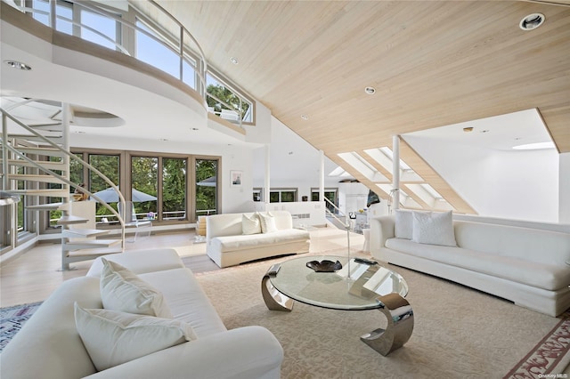 living room with wood ceiling, light wood-type flooring, and high vaulted ceiling