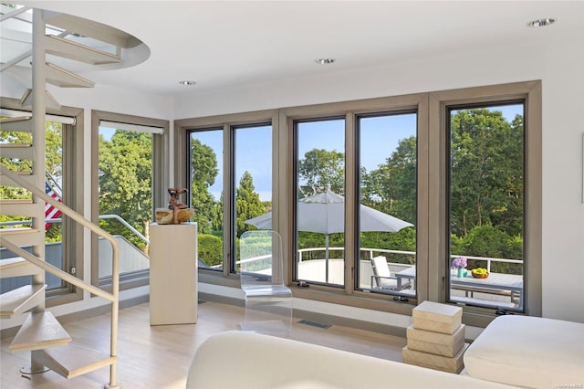 interior space featuring light hardwood / wood-style flooring and multiple windows