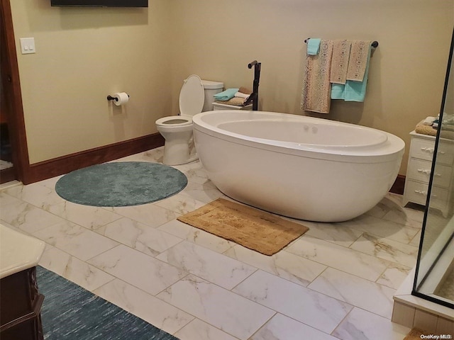 bathroom featuring a washtub and toilet