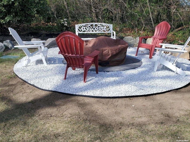 view of patio / terrace featuring an outdoor fire pit