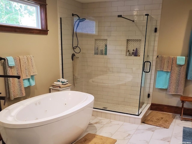 bathroom featuring separate shower and tub