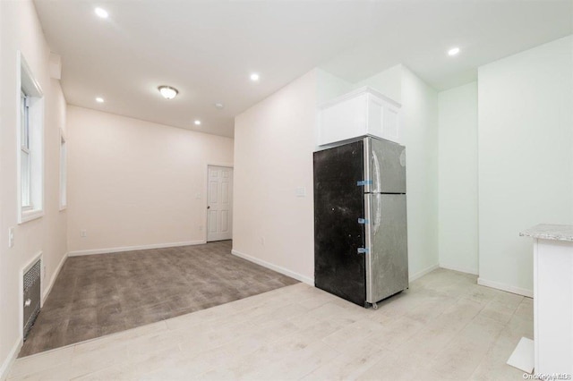 empty room with light wood-type flooring