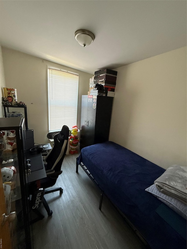 bedroom featuring wood finished floors