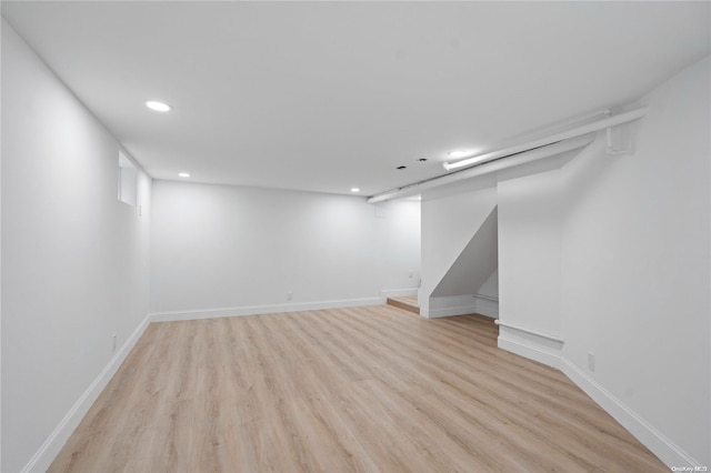 basement featuring light wood-type flooring