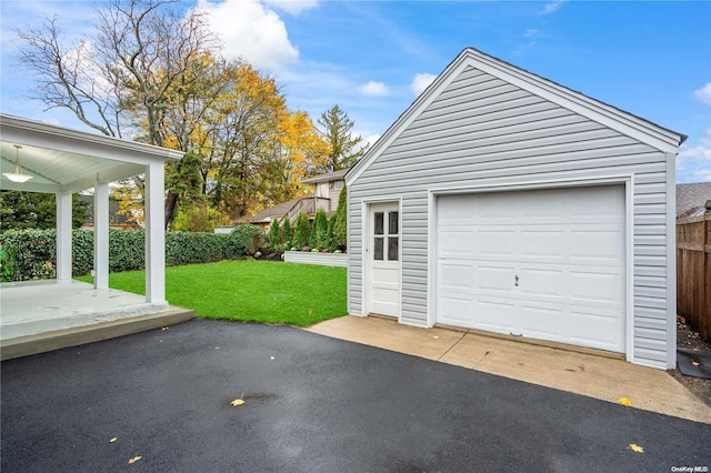 garage with a lawn