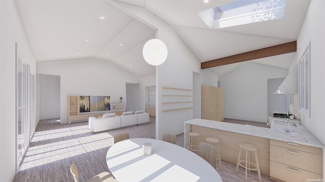 interior space featuring hardwood / wood-style floors, high vaulted ceiling, sink, a skylight, and beam ceiling