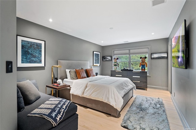 bedroom with light hardwood / wood-style floors