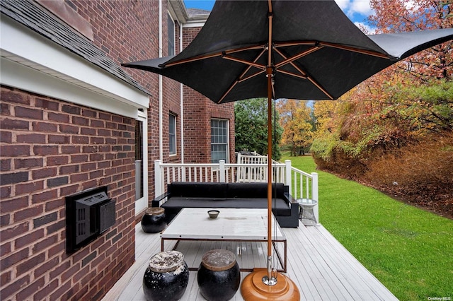 wooden deck with a lawn