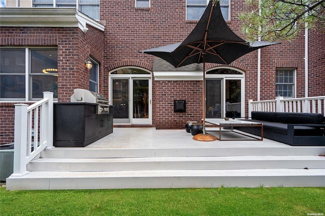 wooden deck with a grill, outdoor lounge area, and central AC