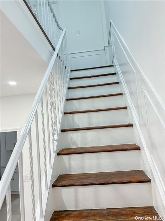 stairs with wood-type flooring