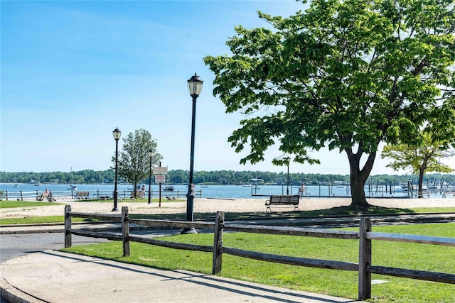 surrounding community featuring a water view