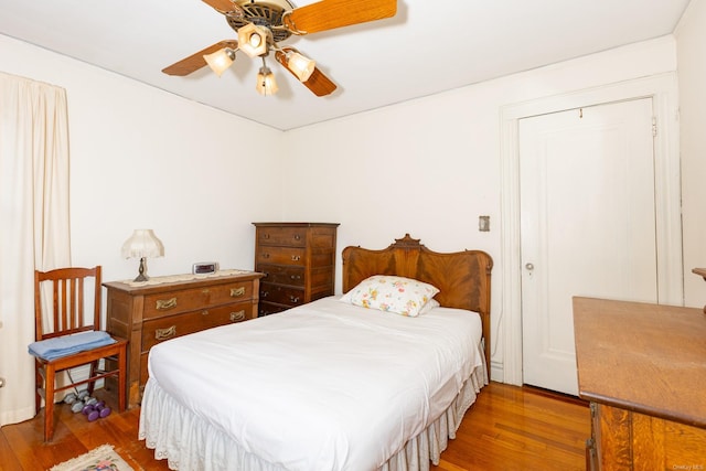 bedroom featuring hardwood / wood-style flooring and ceiling fan