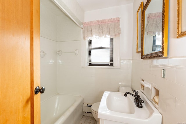 bathroom featuring sink, toilet, tile walls, a baseboard radiator, and a tub