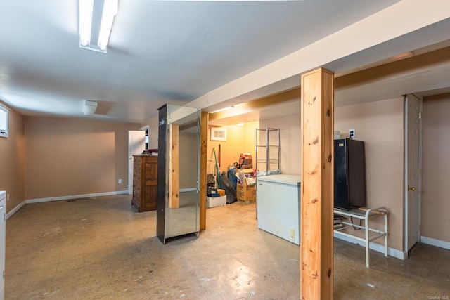 basement featuring refrigerator