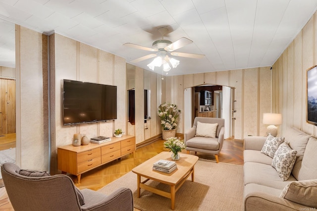 living room with ceiling fan and light parquet flooring