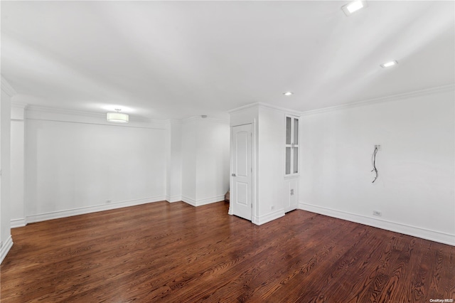 basement featuring dark hardwood / wood-style floors and ornamental molding