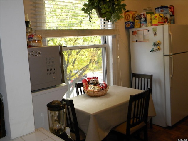 dining space with hardwood / wood-style floors