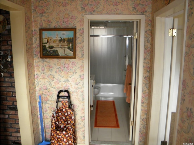 bathroom featuring tile patterned flooring and toilet